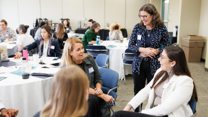 Workshop attendees in discussion with Dr. Julia Abelson.