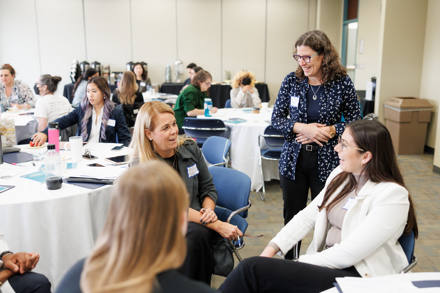 Workshop attendees in discussion with Dr. Julia Abelson.